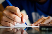 Man Writing with Pen