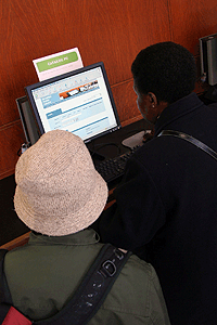 Two People Looking at Computer Screen